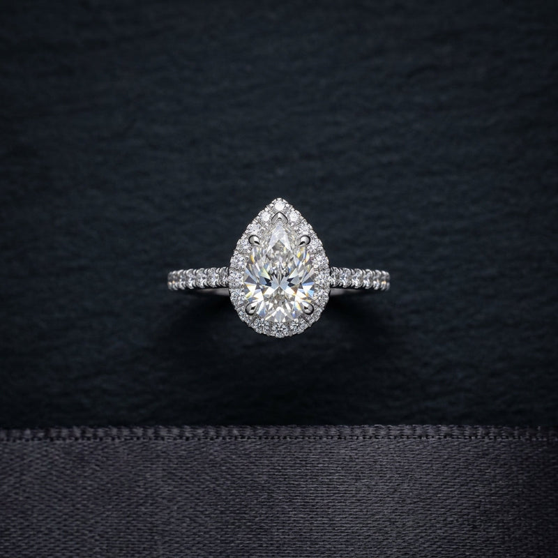 Pear cut diamond halo engagement ring