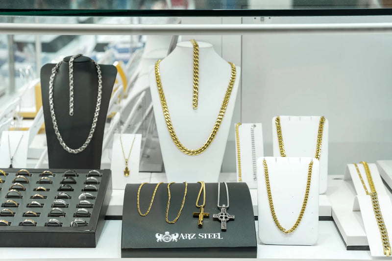 Gold and stainless steel chains and rings at Swift Quartz Jewellers