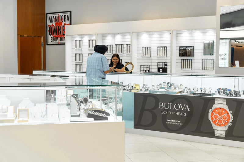 A Swift Quartz jeweller helping a customer choose a watch